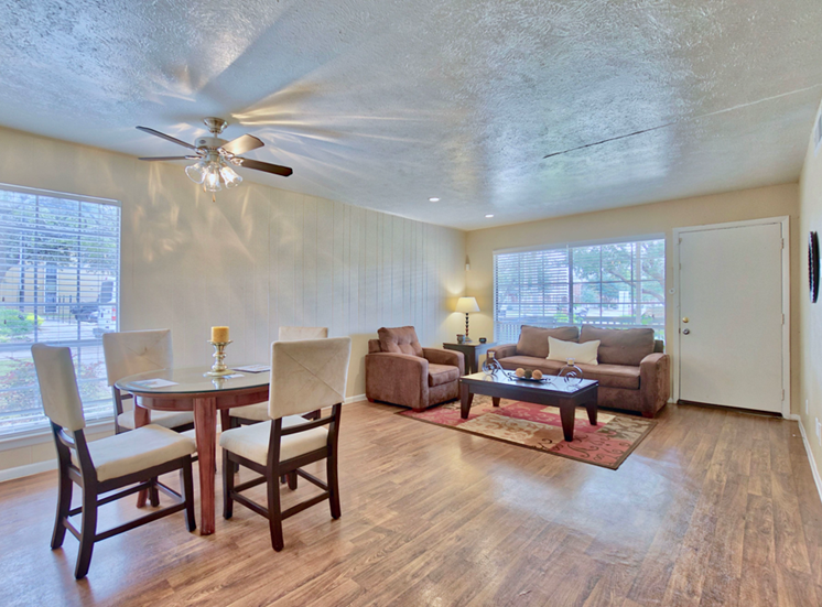 Living room and dining l Woodlands of Plano Apartments in Texas